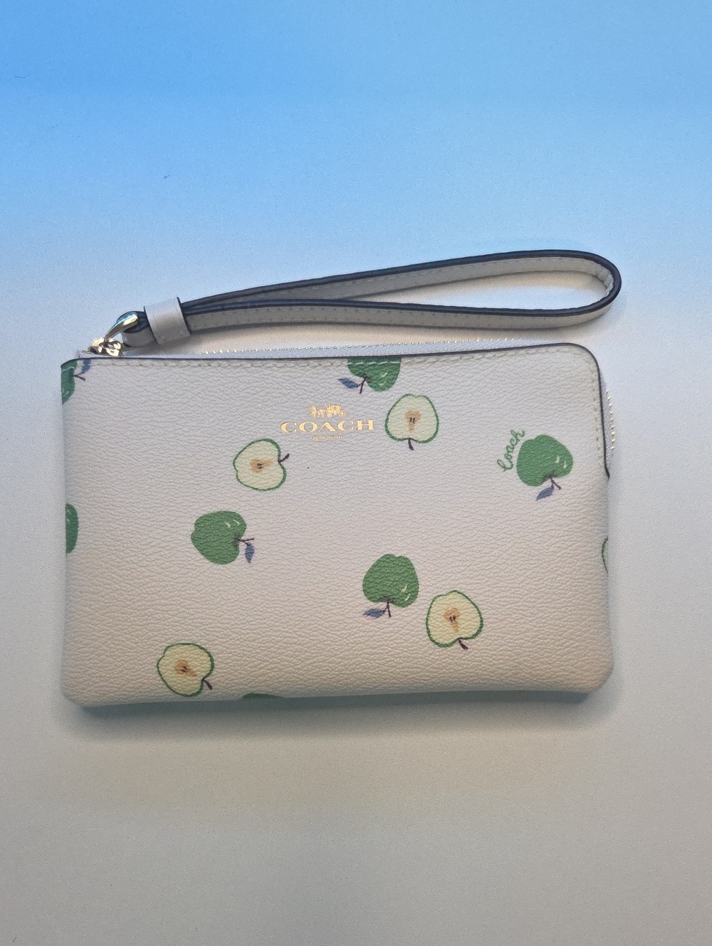 COACH Cream Apple Print Wristlet with Gold Logo